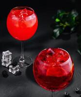 Sangria Cocktails with Ice Cubes and berries photo