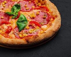 beautiful and tasty pepperoni pizza with corn photo