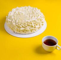 Coffee Mousse Cake with Coffee Cup on Yellow Background photo