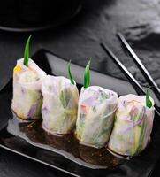 Vietnamese spring rolls on black plate photo