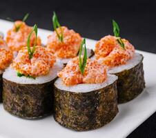 Sushi roll with salmon and caviar photo