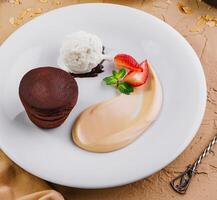 lava cake with ice cream on white plate photo