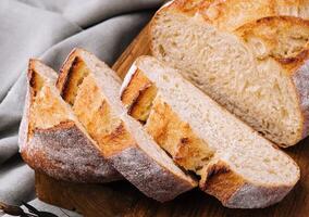 Sliced bread on the board close up photo