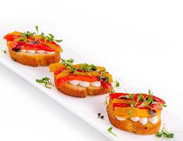 bruschetta with mozzarella and bell pepper photo