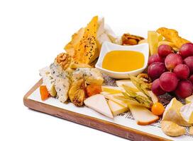 various types of cheese with fruits photo