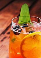 Aperol Spritz with ice on the table close up photo