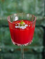 Italian cocktail with flower on gray stone photo