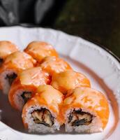 Salmon Fried sushi roll with eel and cheese photo