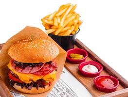 burger with different types of sausages and fries photo