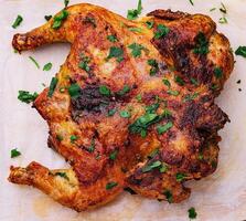 roasted chicken Piri Piri with parsley photo