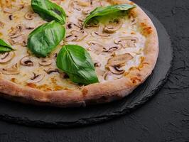 Mushroom pizza with cheese and basil photo