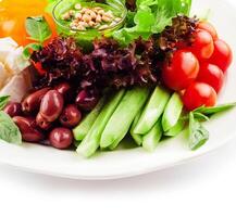 chopped tomatoes, cucumbers, peppers and mozzarella photo