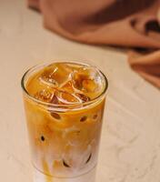 Iced coffee with ice cubes top view photo