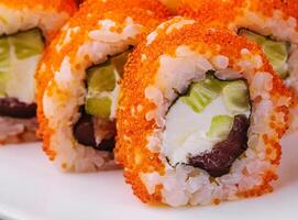 Macro shot of california maki sushi rolls with rice photo