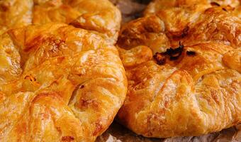 Cooking traditional pies with apple and pumpkin close up photo