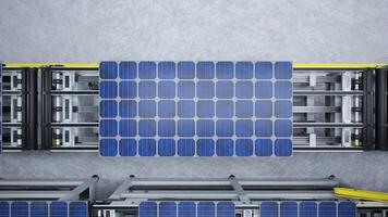 Top down view of solar panels on assembly line operated by high tech robot arms in modern sustainable factory. Aerial shot of photovoltaics produced in modern automated facility photo