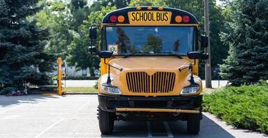 Yellow school bus on the street photo