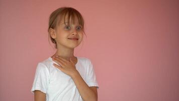 Surprised little girl. Isolate on pink background photo