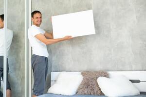 man with canvas mockup. Photo Mockup. The man hold canvas. For canvas design.