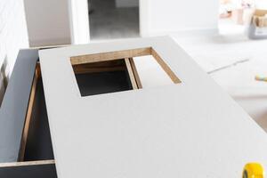 In the kitchen, the square is square-cut for installation of the countertop photo