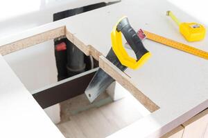 In the kitchen, the square is square-cut for installation of the countertop photo