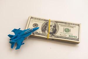 Toy plane and money on background. Travel insurance photo