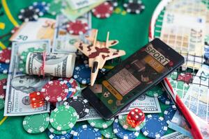 gamble. Poker concept.playing cards, chips and dollars are scattered around the new poker table. photo