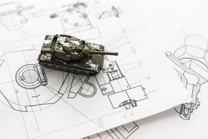 Military machine in the contour lines on graph paper. The contours of the black line on the white background photo