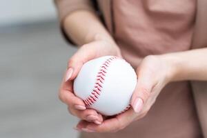 Small toy baseball isolated on white background photo