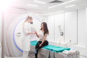 Female patient undergoing MRI - Magnetic resonance imaging in Hospital. Medical Equipment and Health Care photo