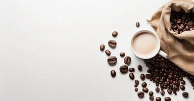AI generated cup of coffee and coffee beans in a sack, top view white background photo