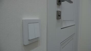 Wall light switch. Controlling the light in the apartment. video