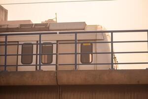 New Delhi India - October 09 2023 - Delhi Metro train arriving at Jhandewalan metro station in New Delhi, India, Asia, Public Metro departing from Jhandewalan station photo