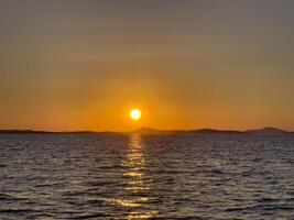 sunset over the sea photo