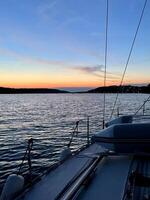 a boat is docked at the water's edge photo