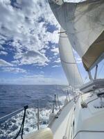 a view of the front of a sailboat on the ocean photo