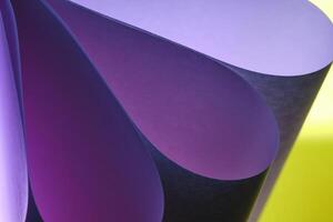 Abstract yellow lilac macro background, smooth lines of paper sheets. photo