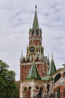 Moscow, Russia May 7, 2023. Spasskaya Tower Moscow Kremlin and part St. Basils Cathedral. photo