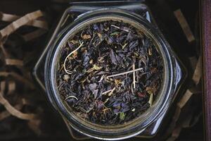 Black and green leaf tea with herbs. photo