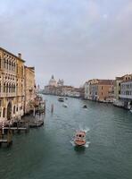 a boat is traveling down a canal in venice photo