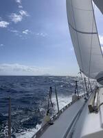 a sailboat sailing in the ocean photo