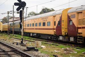 Amritsar, India, February 03 2024 - Indian railway train at Amritsar railway station platform during morning time, Colourful train at Amritsar, Punjab railway station photo