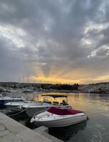 boats are docked at the harbor photo