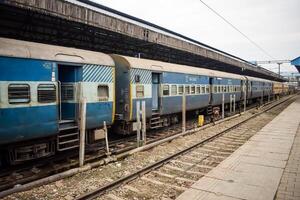 Amritsar, India, February 03 2024 - Indian railway train at Amritsar railway station platform during morning time, Colourful train at Amritsar, Punjab railway station photo