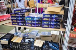 New Delhi, India, September 09 2023 - Variety of Books on shelf inside a book-stall at Delhi International Book Fair, Selection of books on display in Annual Book Fair. photo