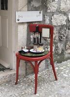 a red chair with a plate on it photo