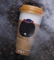 a coffee cup with a face on it is surrounded by coffee beans photo