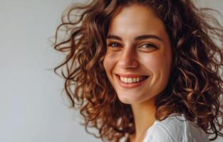 AI generated Dark-haired curly-haired young woman posing in close-up on a monochrome background, portrait, model. AI generated. photo
