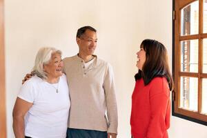 Adult children pay a visit to their Japanese-born mother, embodying the idea of a joyous family. photo