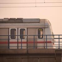 New Delhi India - October 09 2023 - Delhi Metro train arriving at Jhandewalan metro station in New Delhi, India, Asia, Public Metro departing from Jhandewalan station photo